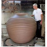 Mark Heidenreich demonstrating his remarkable skill and technique in making gigantic pots and urns, well designed and beautifully crafted. Marks studio Terra Villa Pottery is situated in the heart of Adelaide near the Central Markets. Many of these large ceramic and terracotta pots are made for outdoor use but are equally at home as a feature in a gallery or home. They are impressive in their scale and beautiful in their form. Photo courtesy of the 2012 Australian Ceramics Triennale.